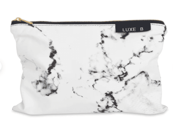 a makeup bag with a marble fabric