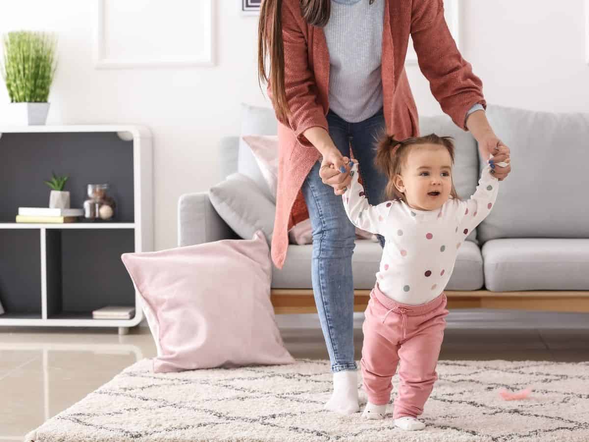 a mom walking with her baby