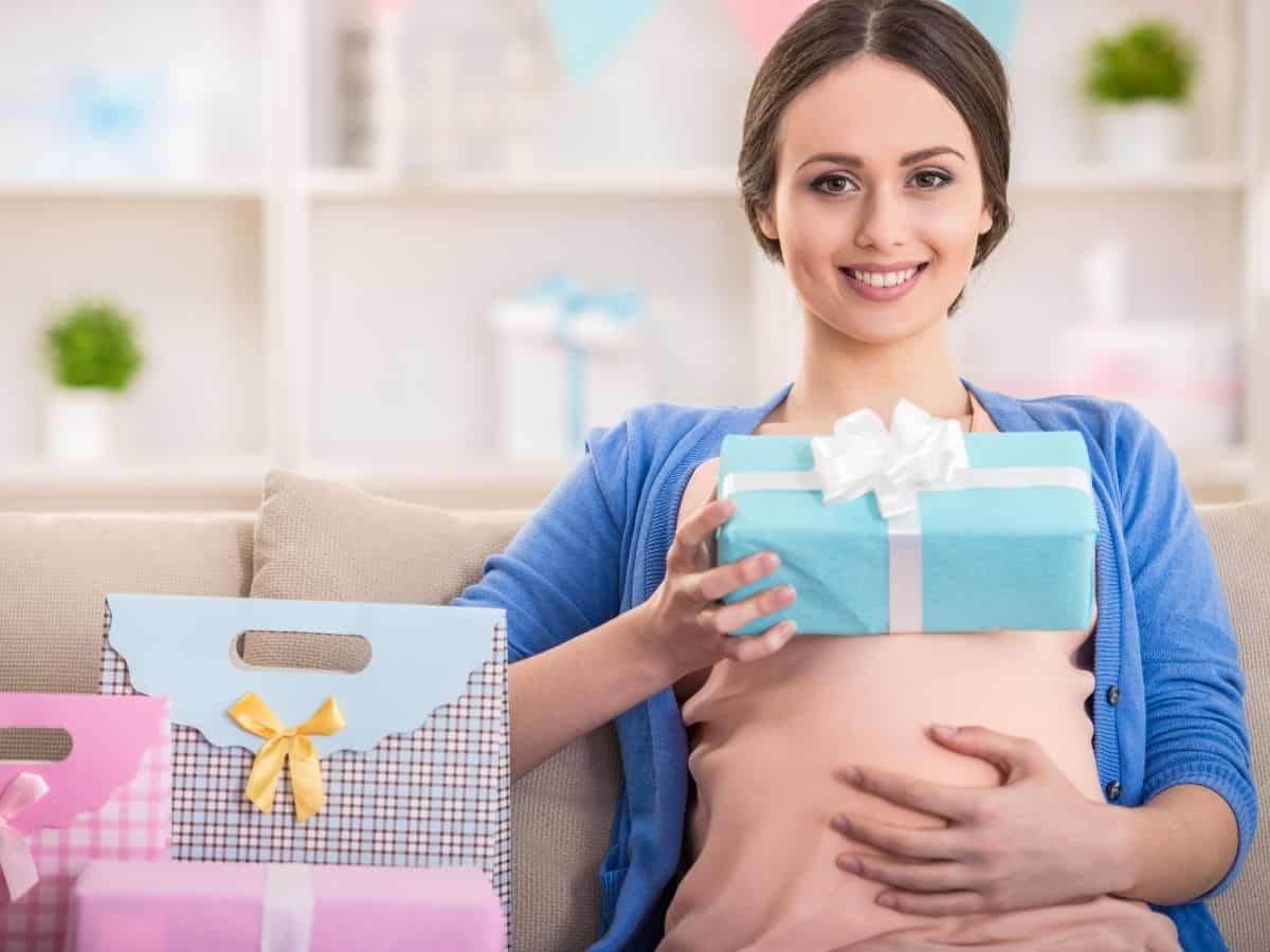 a pregnant mom surrounded by gifts.