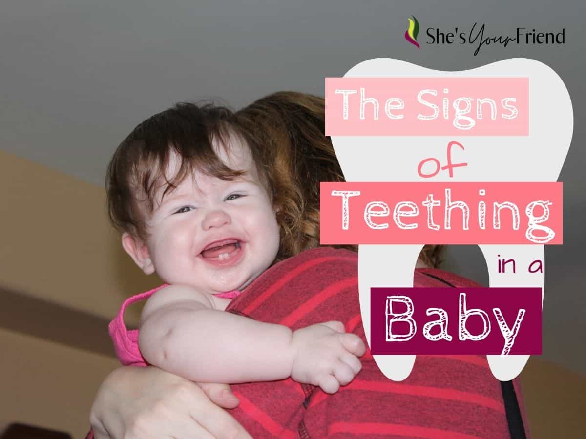 a woman holding a smiling baby with text overlay that reads the signs of teething in a baby