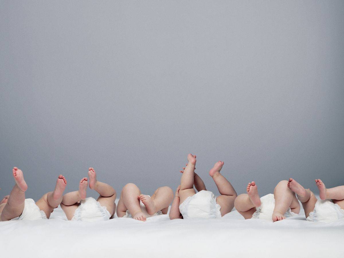 a bunch of babies wearing only diapers.