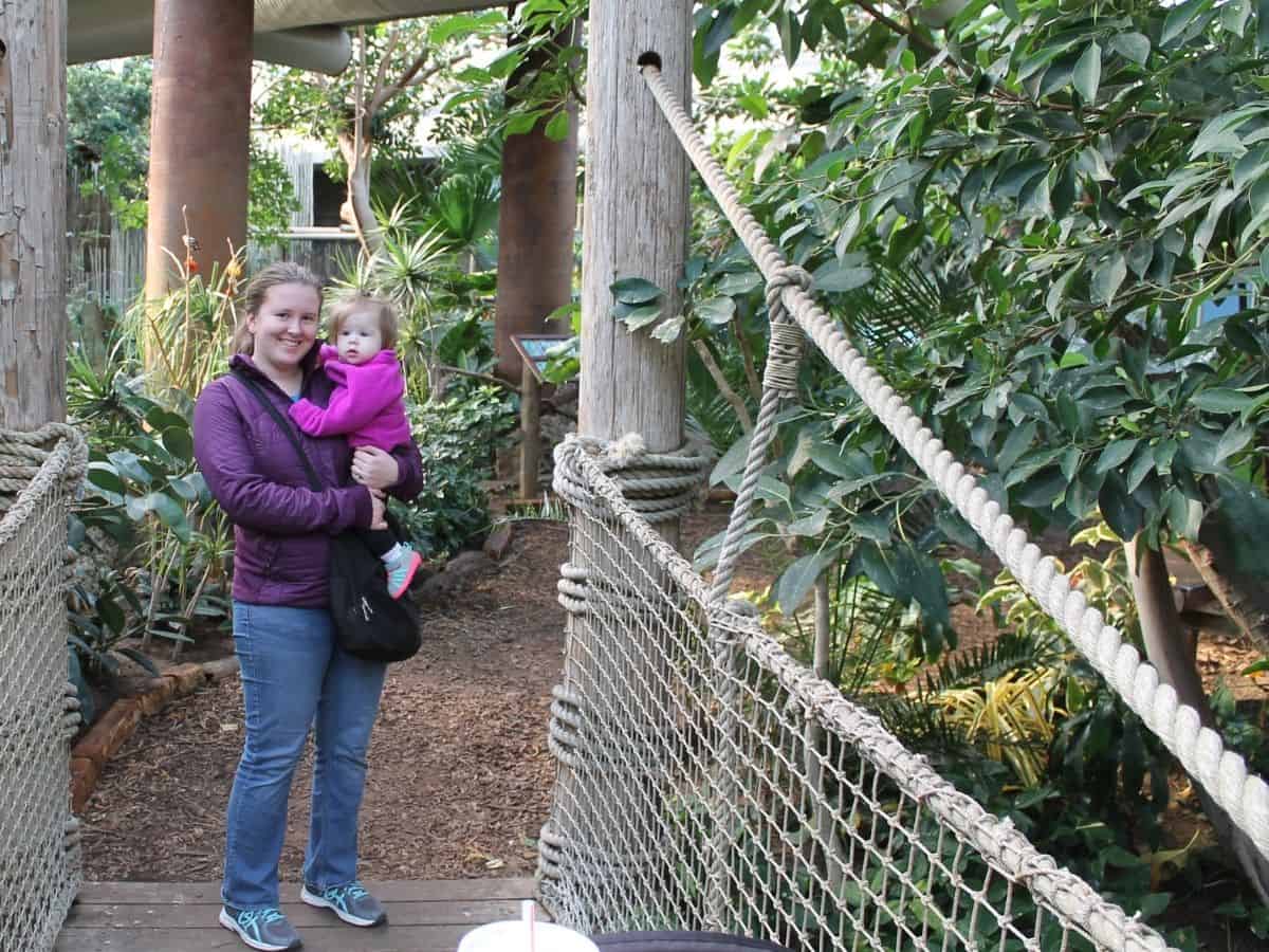 a woman holding her little girl