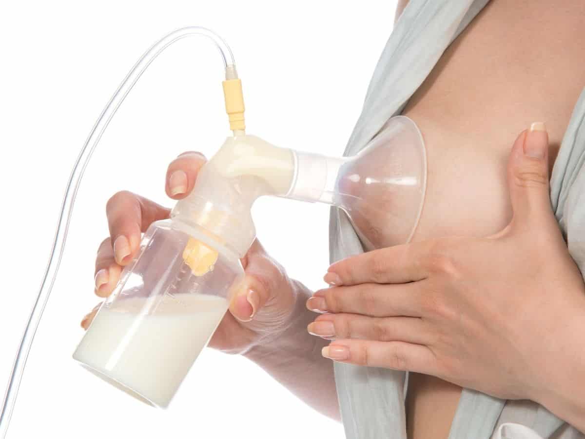 a woman with a breast pump who is pumping milk