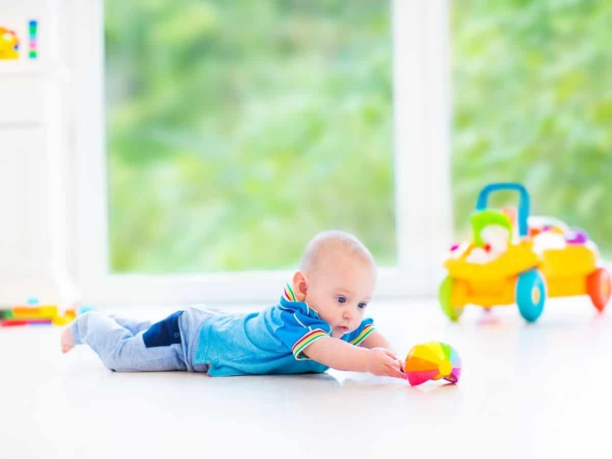 a baby having fun playing with toys during tummy time