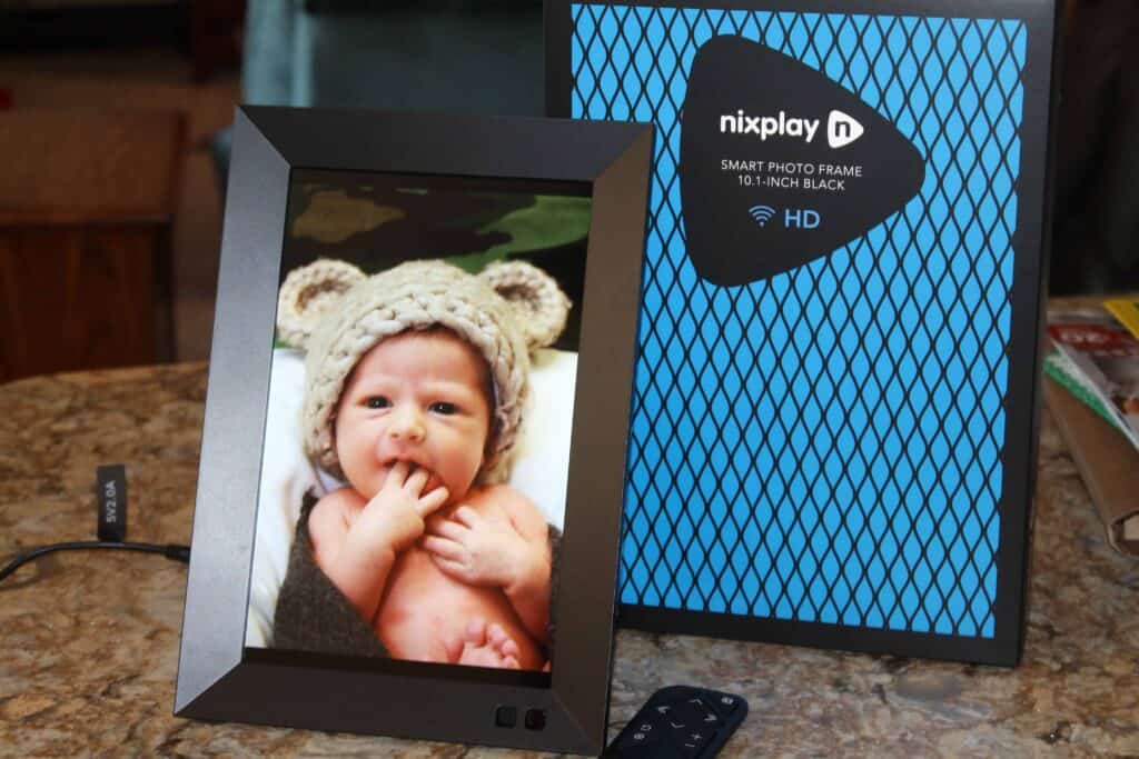 nixplay smart photo frame displaying a cute baby photo.