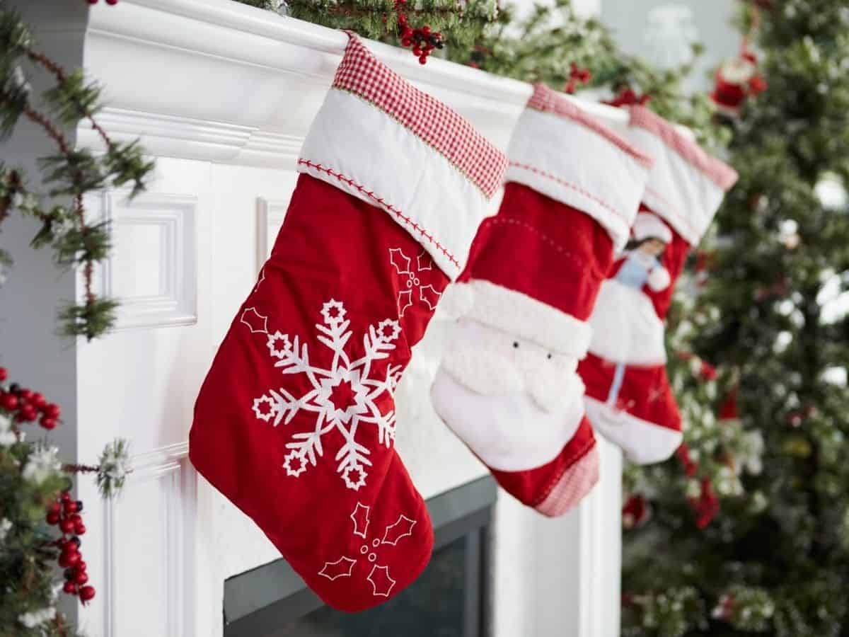 three stockings hung by the mantle