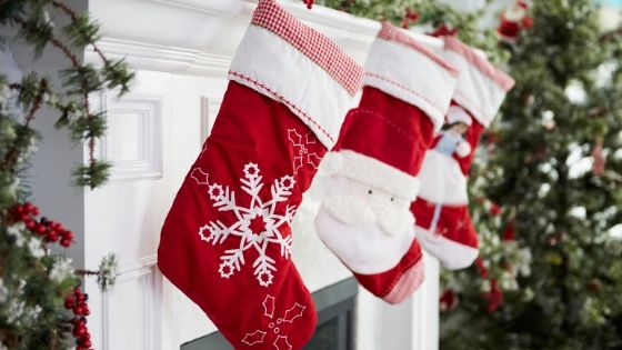 Christmas stockings hung by the fireplace mantle