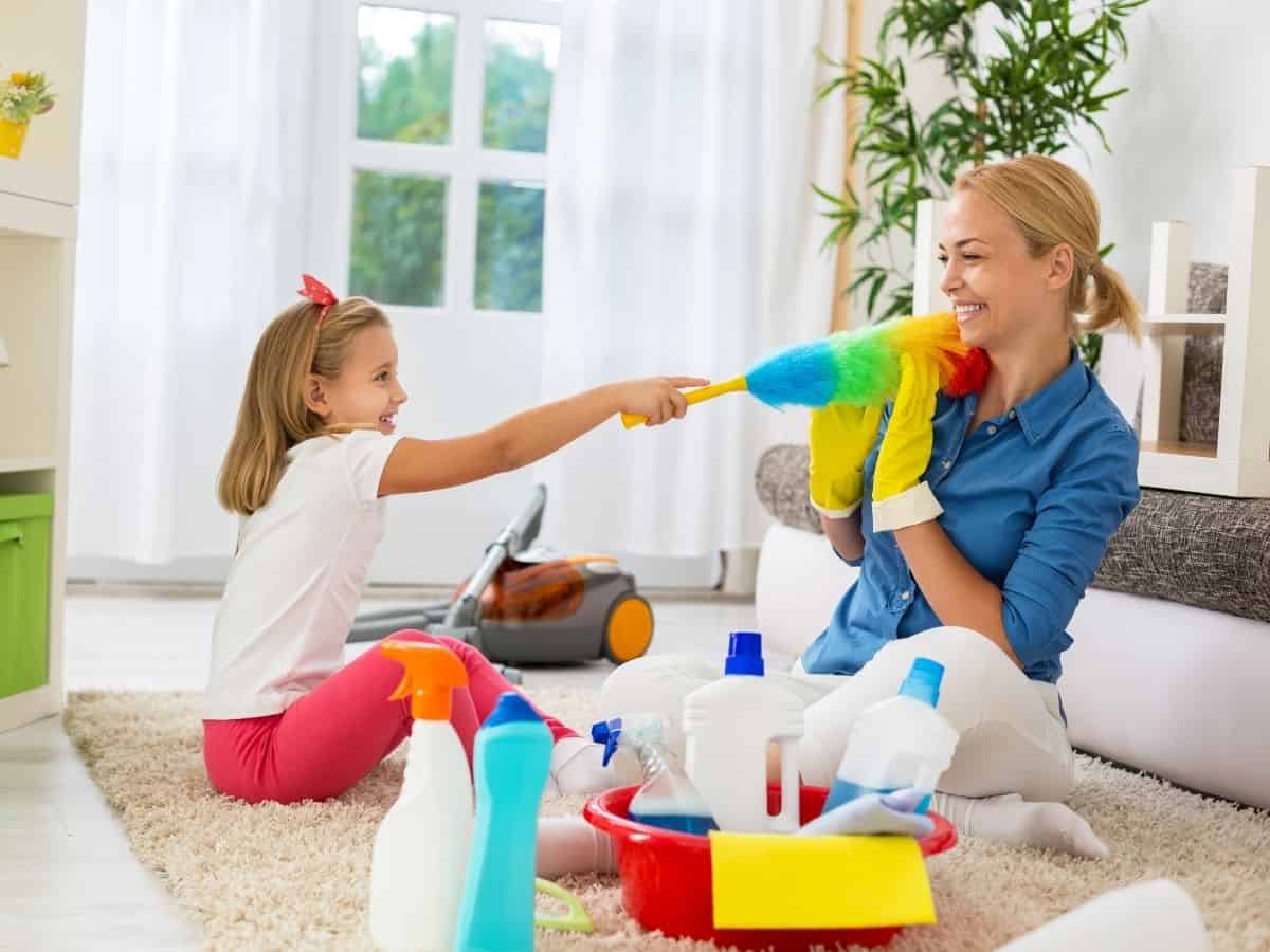 a mom showing her daughter how to do chores