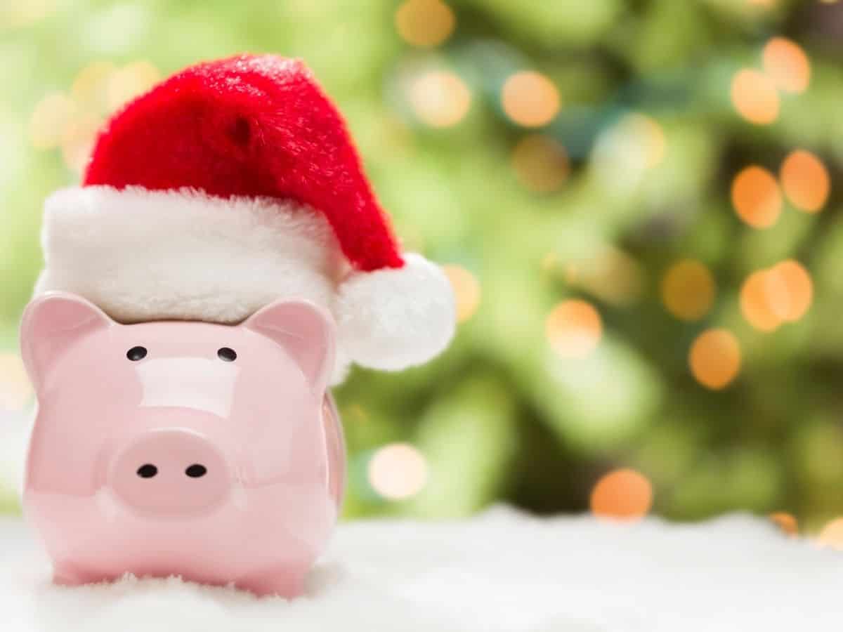 a piggy bank with a santa hat on.