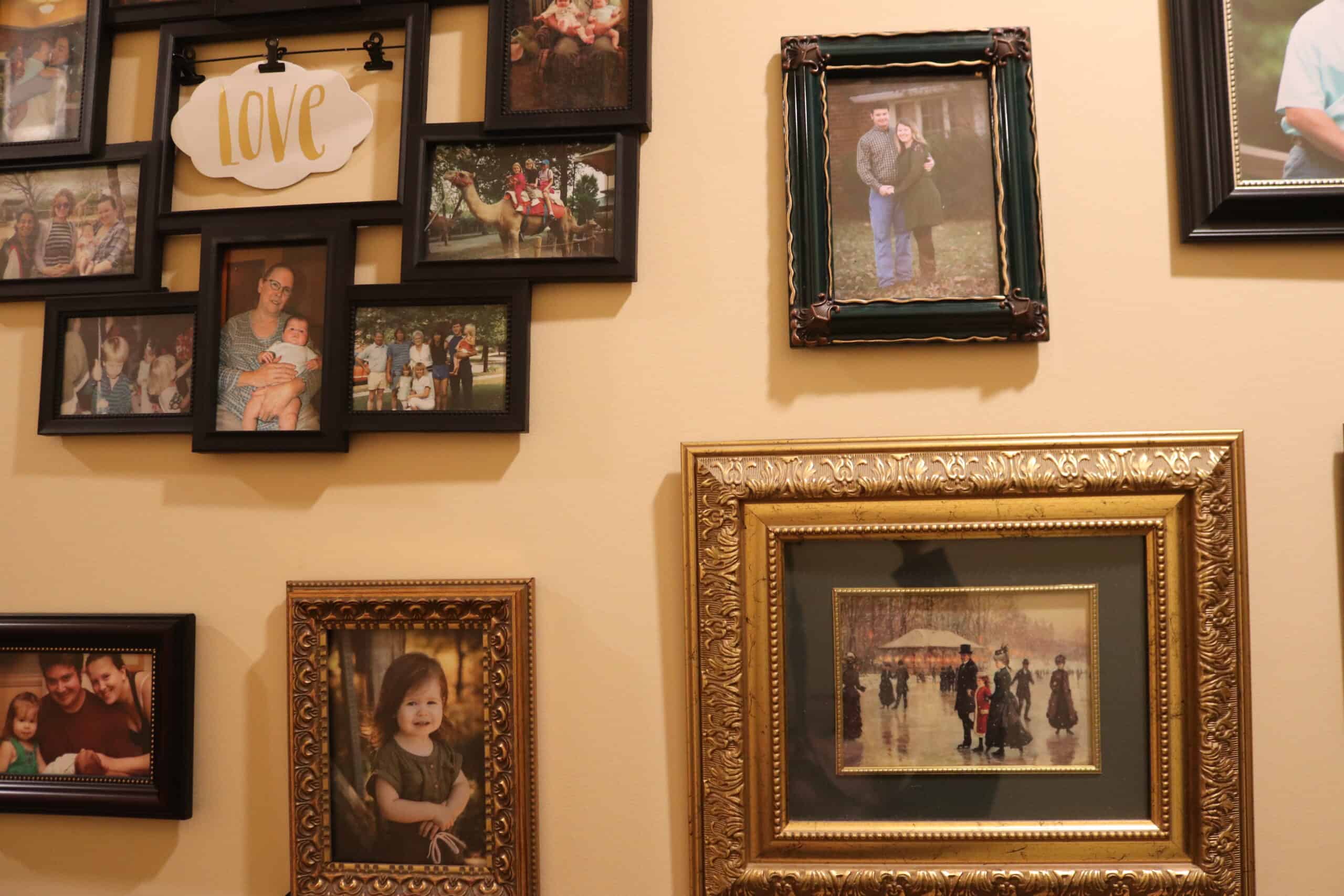 a buch of different picture frames hung on a wall