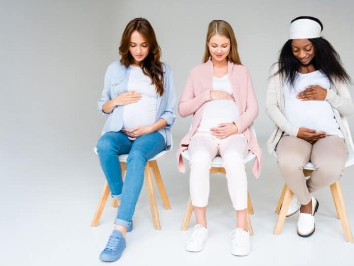 three pregnant women wearing maternity leggings