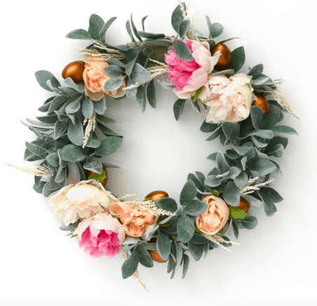 an easter wreath with lambs ear, peonies, and golden eggs