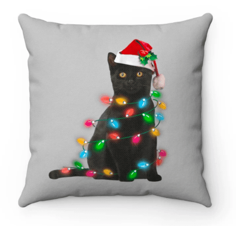 a throw pillow with a cat and some Christmas lights