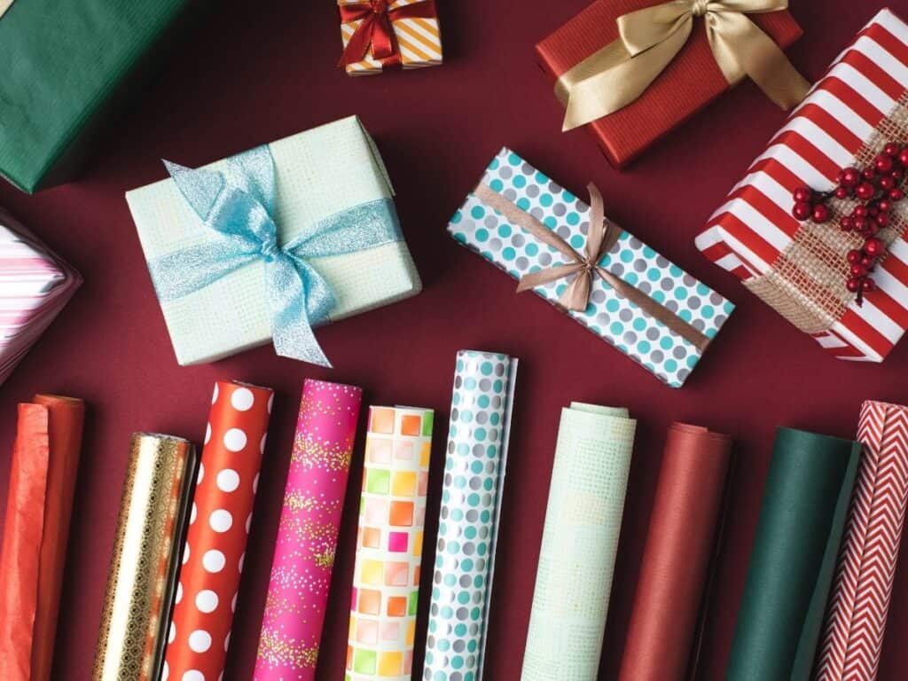 gifts wrapped up and extra wrapping paper shown