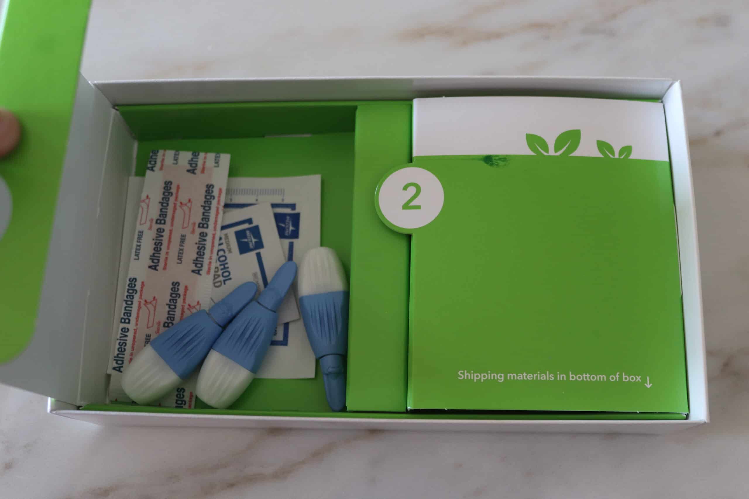 Everlywell food sensitivity kit including finger pricks, bandaids and alcohol wipes