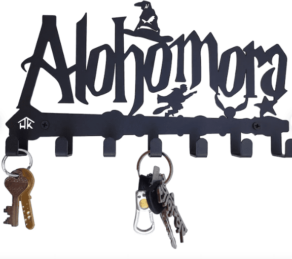 a metal wall mounted key holder with the word alohomora on it