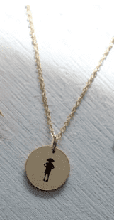 a necklace with Dobby the house elf from harry potter