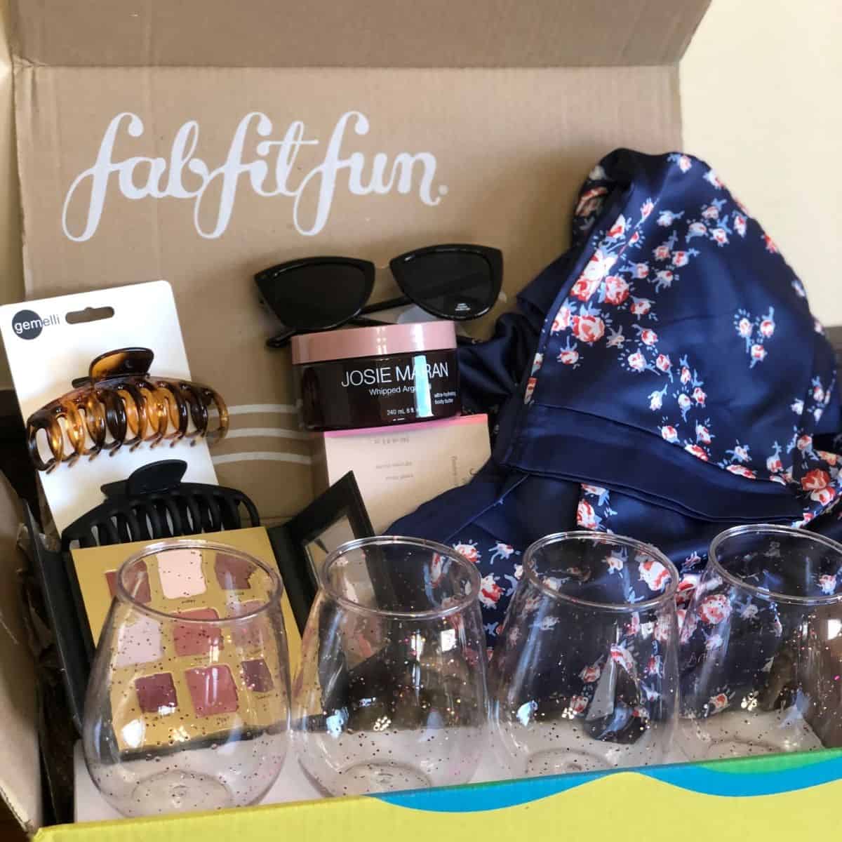 spring fab fit fun box with lotion a robe sunglasses drinkware, hair clips, and eyeshadow palette