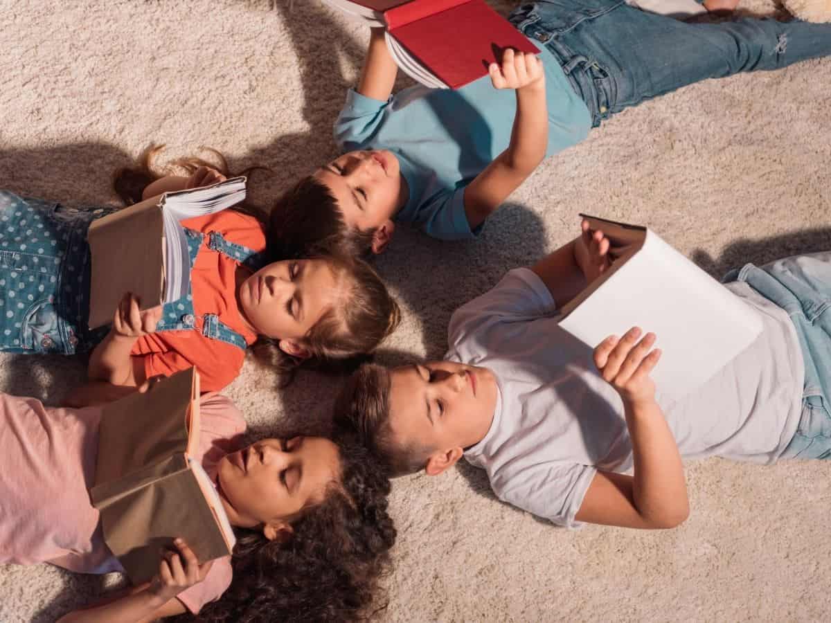 four kids reading books