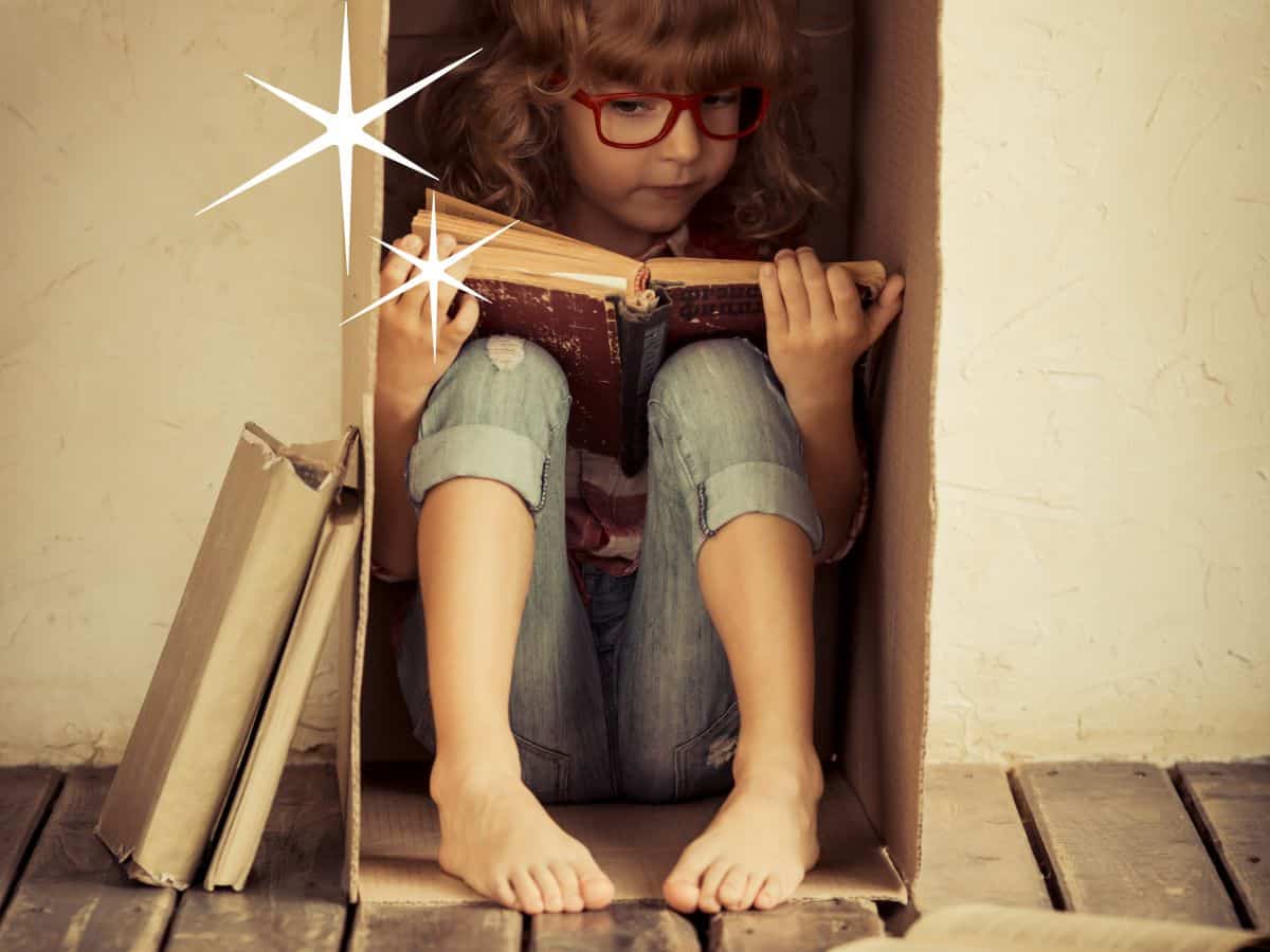 a girl reading in a box with other books beside her and two spark graphics