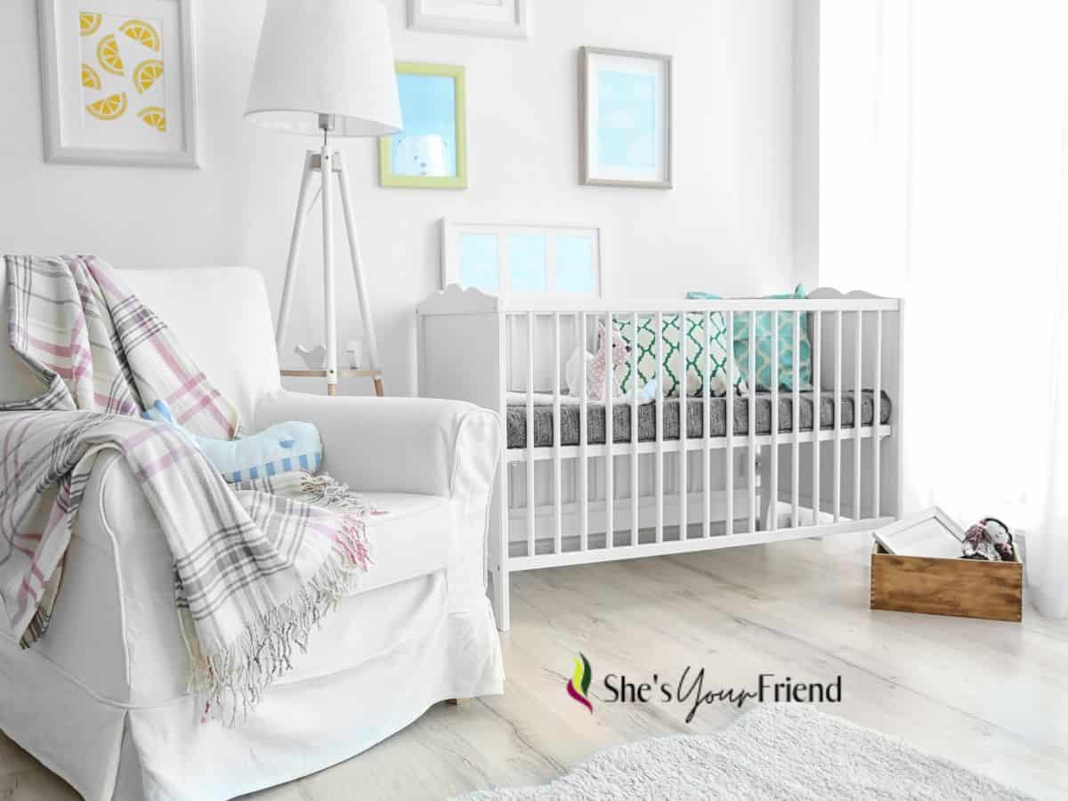 a baby nursery with a glider as the focal point of the room