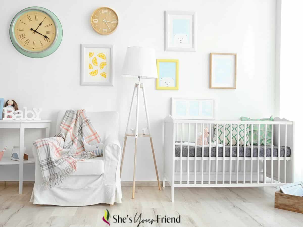 a baby nursery room with a crib glider lamp and other decor