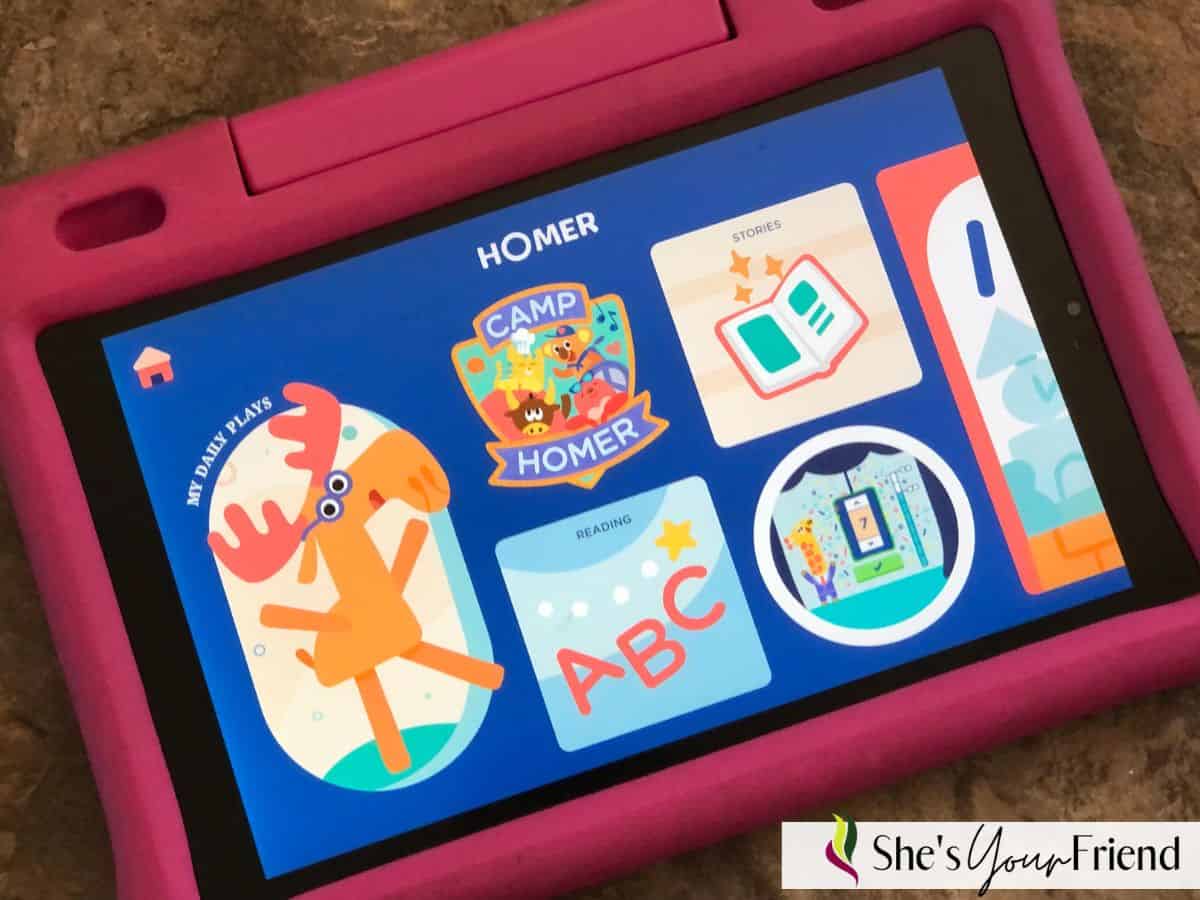 a pink kids tablet with the homer app playing