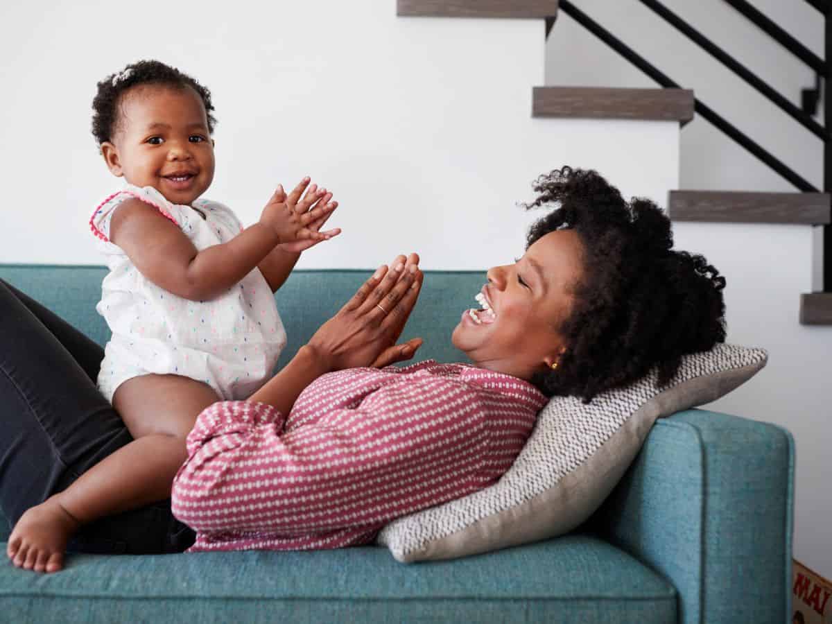 a mom and her baby both clapping