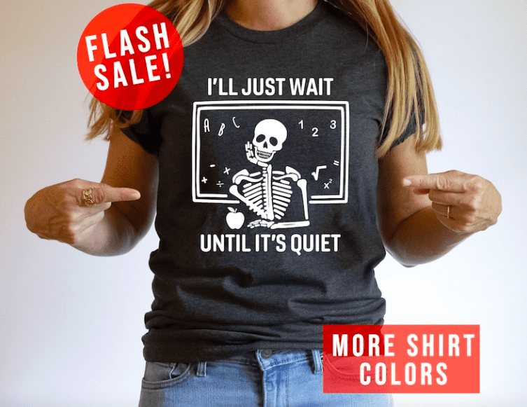 woman wearing a shirt that says I'll just wait until it's quiet with a skeleton