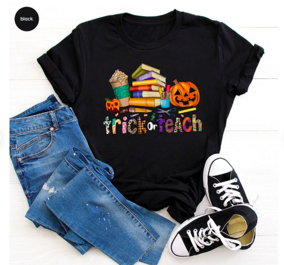 an outfit flatlay with jeans a trick or teach shirt and shoes