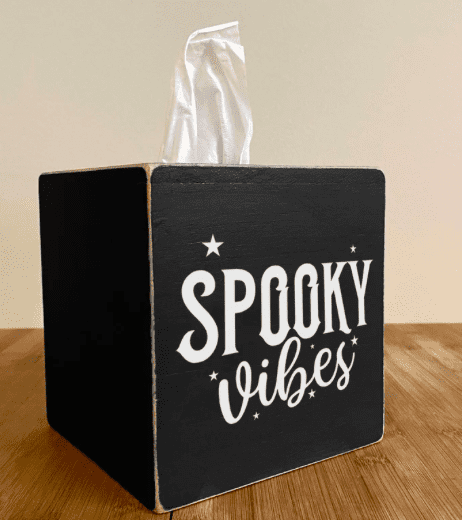 a tissue box cover that says spooky vibes