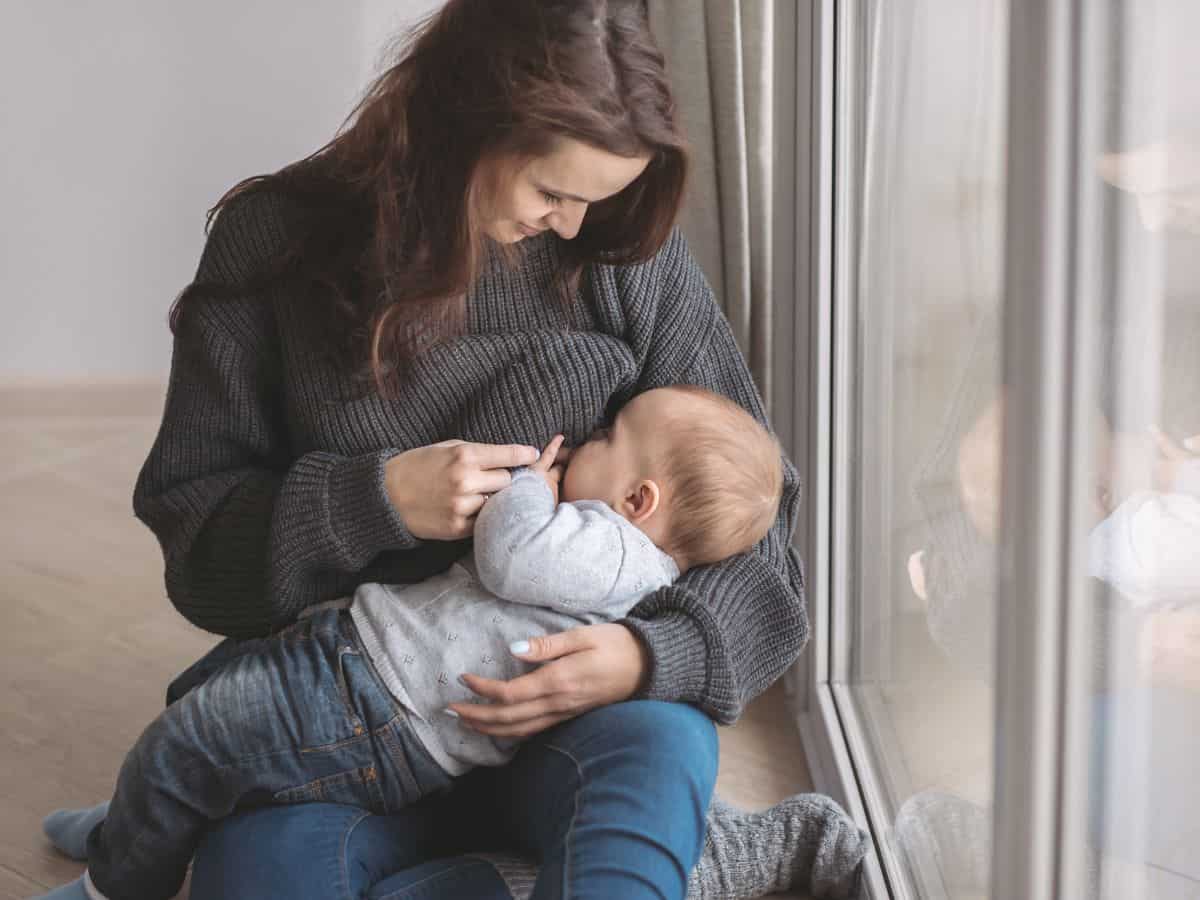 a mom breastfeeding her baby