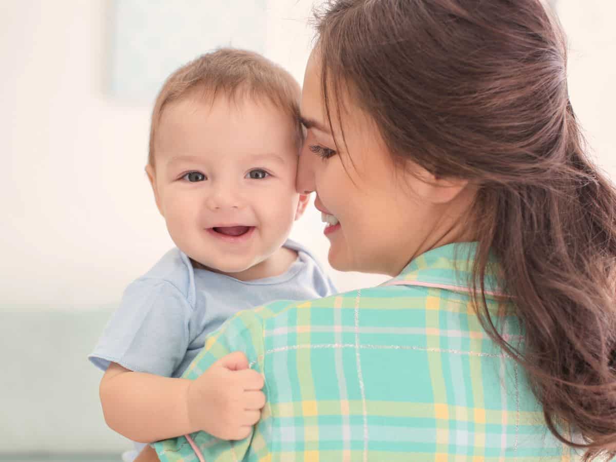 a mom talking to her 1 year old baby