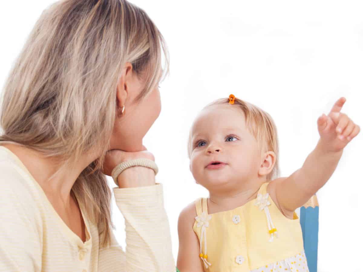 a 1 year old talking to her mom