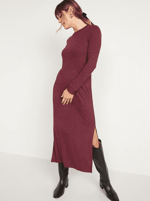 a woman wearing a cranberry red long sleeve dress