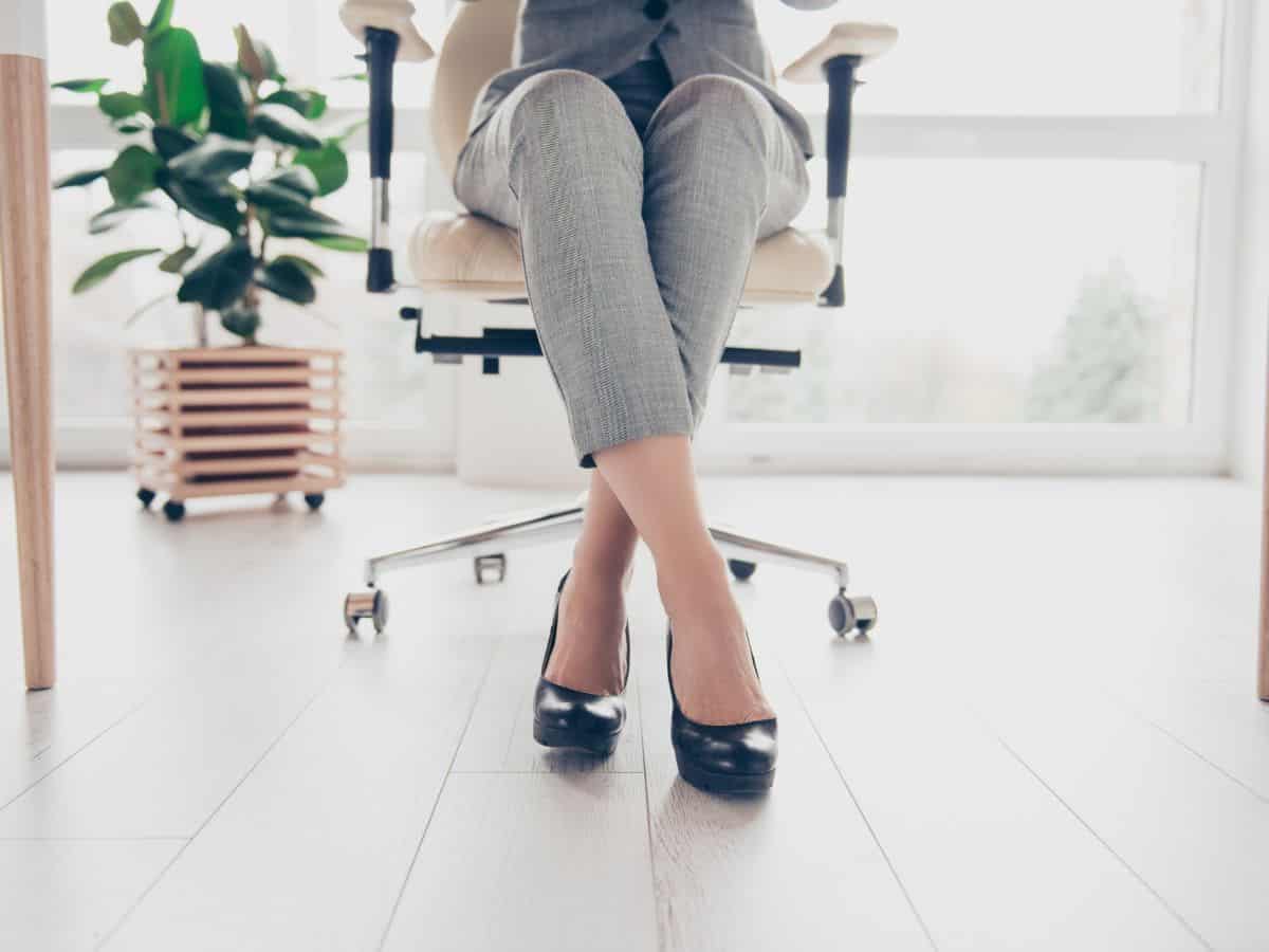 a woman wearing a pant suit at an office