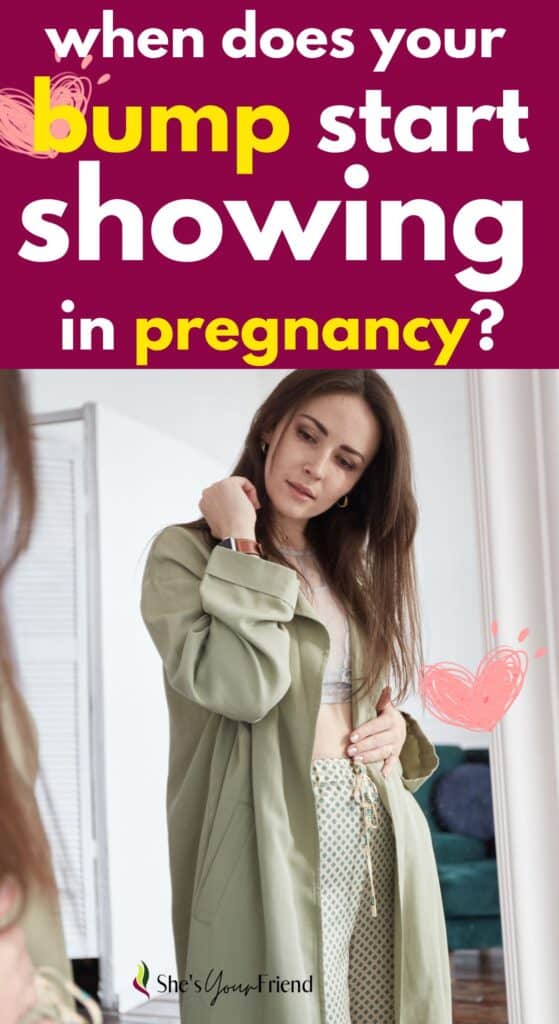 a woman looking in the mirror with text overlay that reads when does your bump start showing in pregnancy