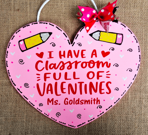 a personalized teacher valentines day heart door sign that says I have a classroom full of valentines Ms Goldsmith