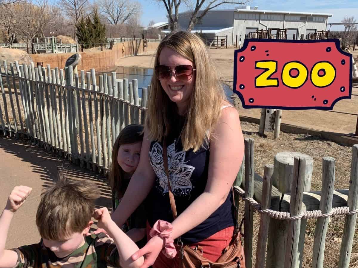 a mom with her kids at the zoo with text overlay that reads zoo