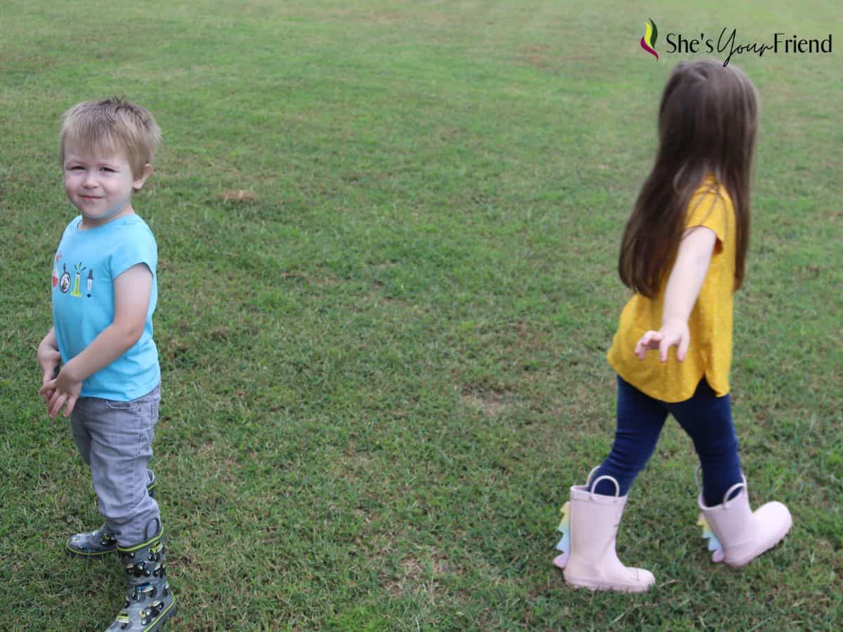 two kids wearing rain boots