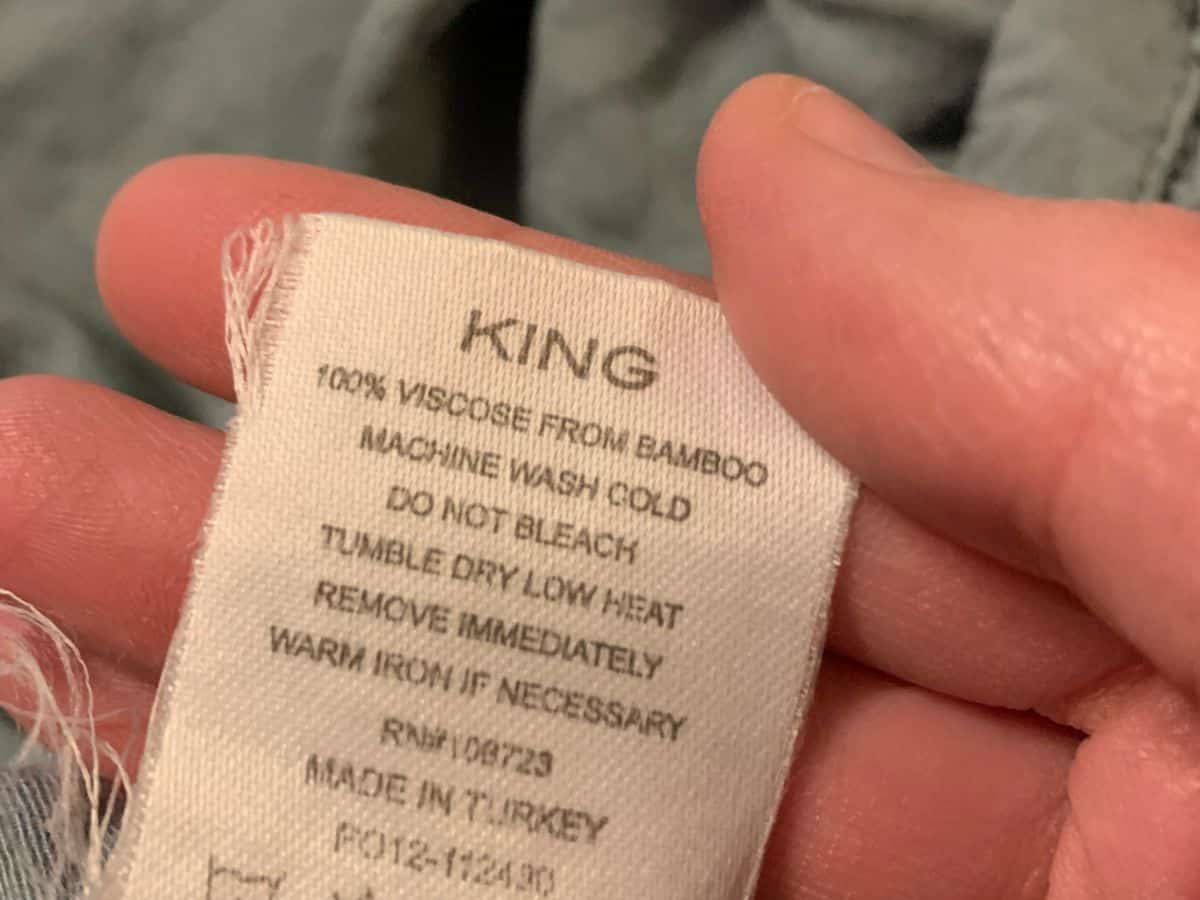 a care tag for Cariloha bamboo sheets that says 100% viscose from bamboo machine wash cold do not bleach tumble dry low heat remove immediately warm iron if necessary