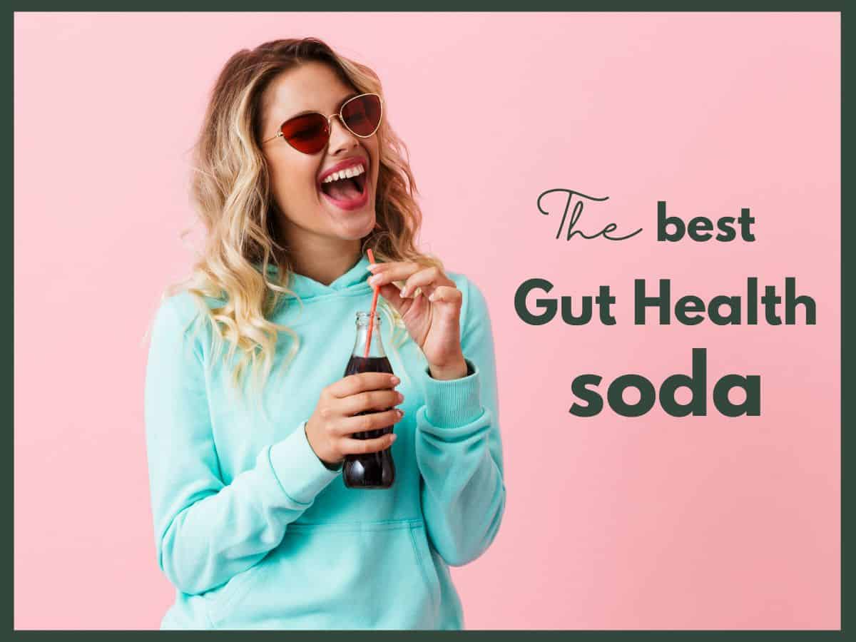 a woman holding a bottle of pop with text overlay that reads the best gut health soda