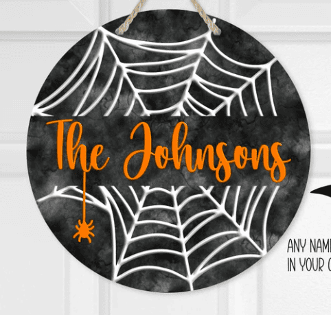 a personalized hanging door sign for Halloween