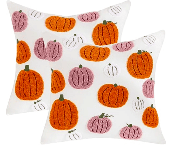 two pillows with pink orange and white pillows 