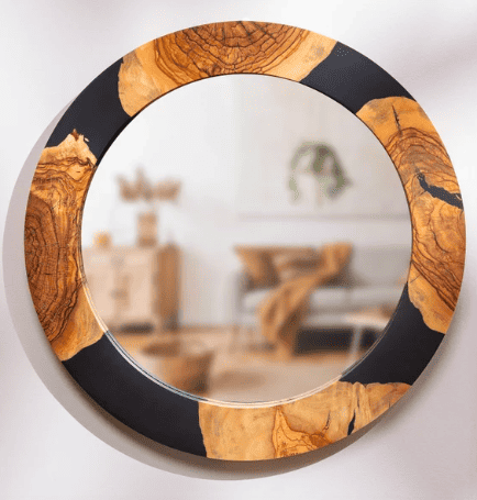 a black resin and wood mirror