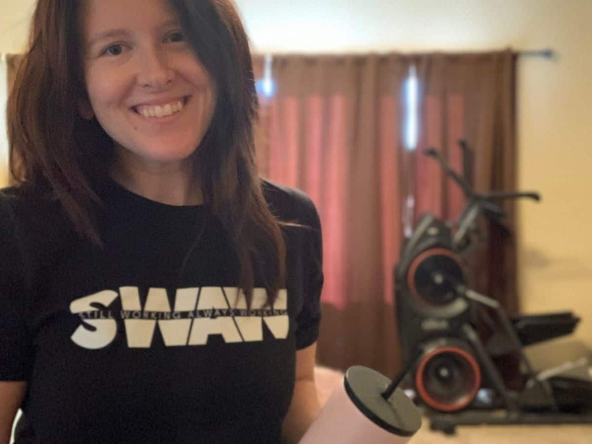 a woman wearing fitness apparel in a home gym