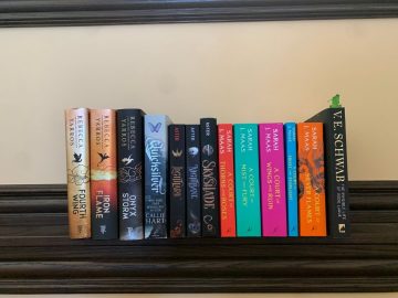 a bunch of romantasy books on a shelf